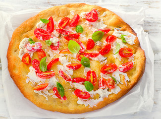 Focaccia with tomatoes, cream cheese and basil