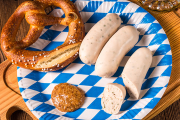Bavarian sausage with pretzel, sweet mustard and beer