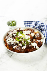 Meatballs in tomato sauce with feta cheese