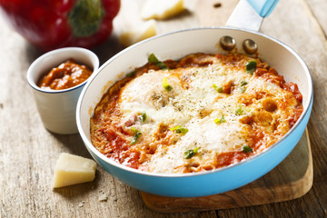 Omelette with cheese, bell pepper and tomatoes
