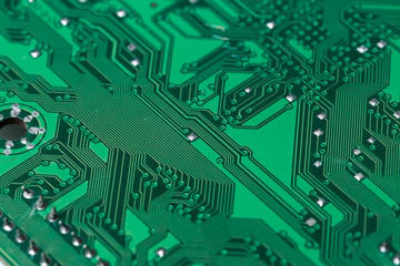 Close up of a printed green computer circuit board