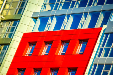 Part of the facade modern building with red and blue