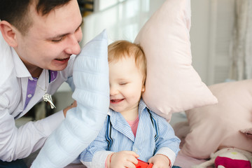 Happy father playing with his wonderful son