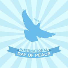 International day of peace vector illustration with dove, olive branch and ribbon on rays background.