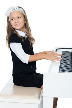Girl sitting at piano