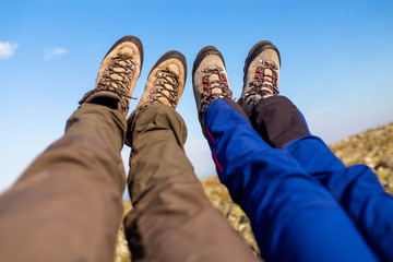 Two hikers putting their feet up and taking a rest