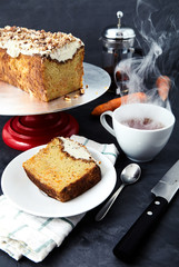 Slice of carrot cake with tea