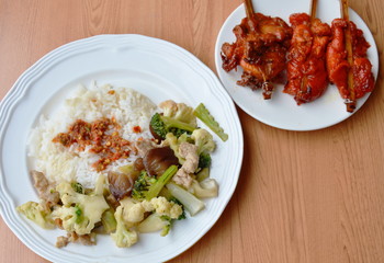 stir fried mixed vegetable and grilled chicken on dish