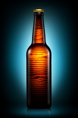 Bottle of beer or cider isolated on dark blue background