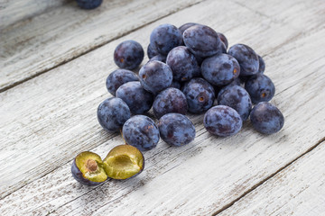 Fresh plums in cup