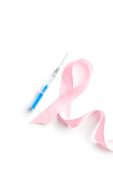 Pink ribbon and syringe.