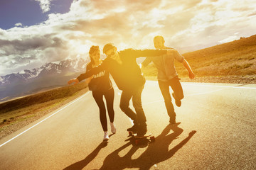 Group friends longboarding road travel concept