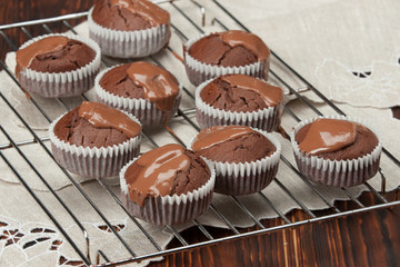 Obraz na płótnie Canvas Homemade Cocoa Muffins With Chocolate Cream. Natural Linen Napki