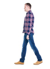 Fototapeta premium Back view of going handsome man in checkered shirt. walking young guy . Rear view people collection. backside view of person. Isolated over white background.