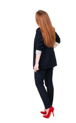 back view of redhead business woman contemplating. Young girl in suit.  Rear view people collection.  backside view of person.  Isolated over white background.
