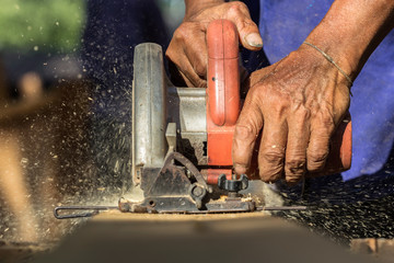 Close-up of carpenter's hands working with wood