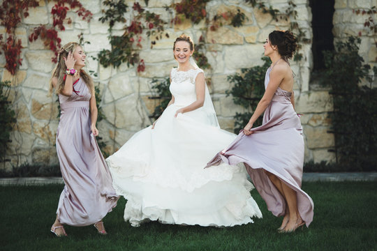  funny bridesmaids spends wonderful  time with  happy bride