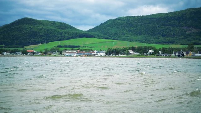 View of the Shore during a Windy Summer day with lots of Waves in Carleton, Quebec.