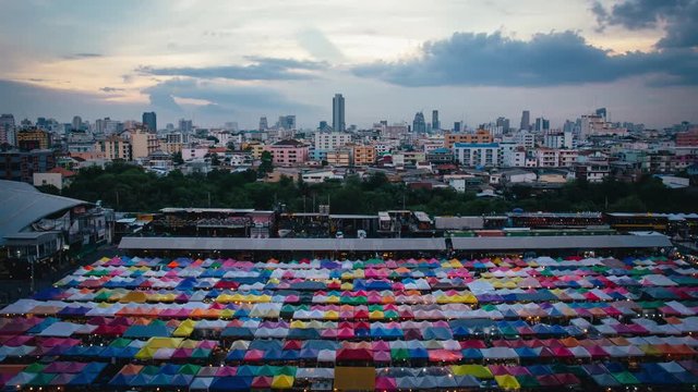 BANGKOK, THAILAND - July 17, 2016 : 4K Time-Lapse with Sunsets and Clouds at Train Night Market Ratchada, Bangkok, Thailand
