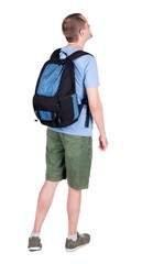 Fototapeta premium Back view of man with backpack looking up. Rear view people collection. backside view of person. Isolated over white background. guy in the green t-shirt stands with a suitcase on wheels
