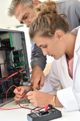 Student and teacher in electrical engineering course