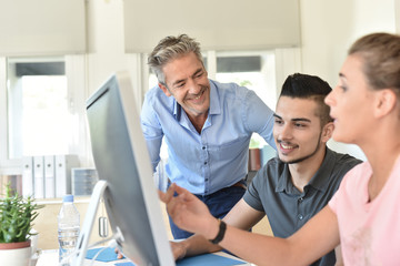 Students in business class with trainer