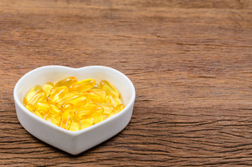 fish oil in heart shape bowl