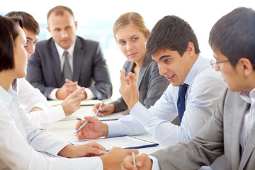 Young business people communicating at the table