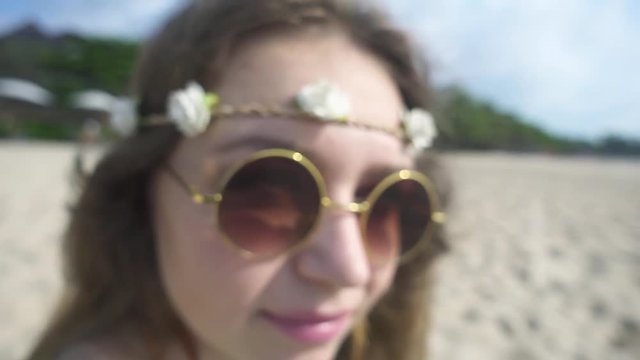 Camera Zooms In to Woman's Face in a Round Sunglasses. Slow Motion