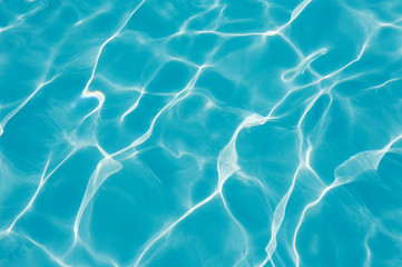 Ripple Water in swimming pool with sun reflection, Blue water abstract