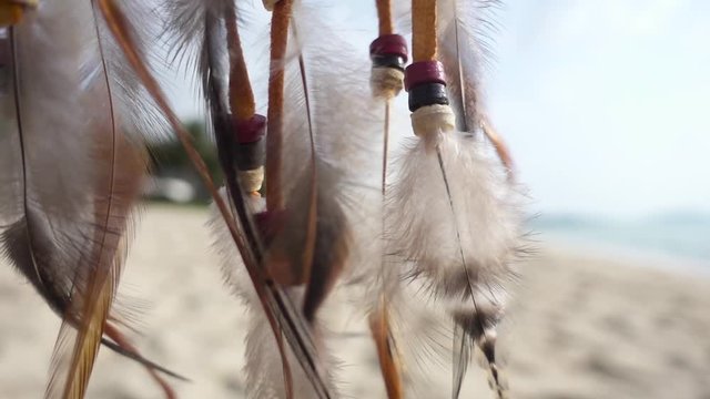 Dream Catcher Swinging at the Wind on the Beach. Slow Motion