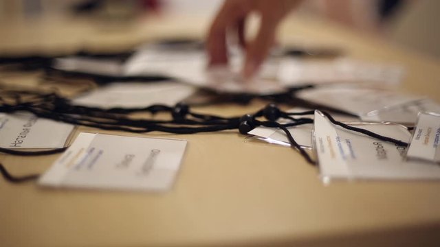 People take badges before the conference
