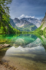 Naklejka na ściany i meble Mirror reflection of the Alps in green Obersee lake, Germany