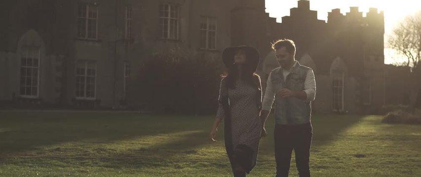 Amazing cuple walk near castle