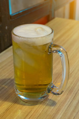 Glass of light beer in cafe