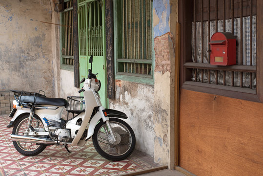 Motorbike and old Chinese house in Georgetown, Penang, Malaysia