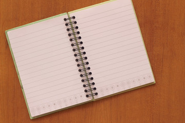 blank notebook on wooden table