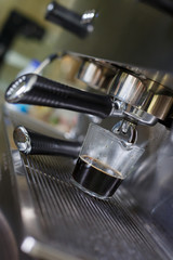 Fototapeta na wymiar coffee making process from coffee machine in cafe shop