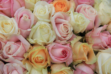 Pastel roses in a wedding arrangement