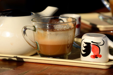 Coffee and tea on the white plate