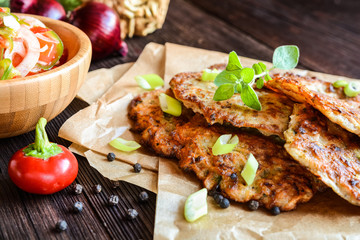 Fried celery pancakes with vegetable salad