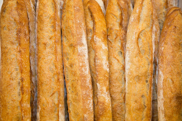 French baguettes in a basket in modern bakery