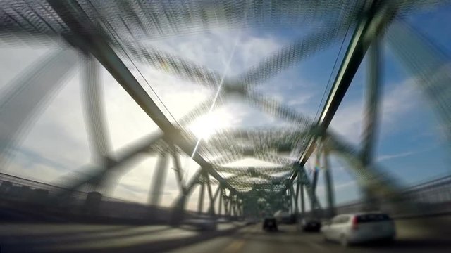 Timelapse of Suctioned Camera on the hood of a Car Crossing the Jacques-Cartier Bridge in Montreal City.