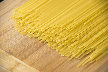 Bunch of spaghetti on wood background