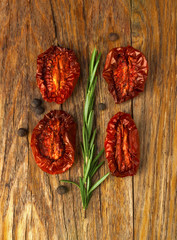 Delicious Dried Tomatoes, a branch of rosemary