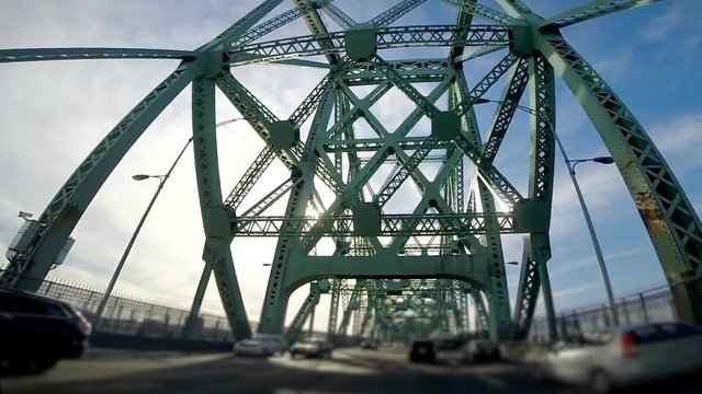 Slow Motion of Suctioned Camera on the hood of a Car Crossing the Jacques-Cartier Bridge in Montreal City.