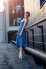 Beautiful contemporary dancer in blue dress
