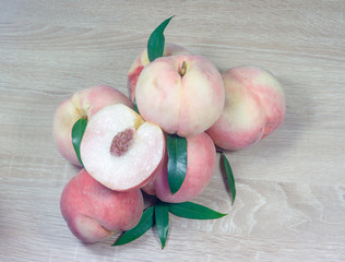 fresh peaches on wood background