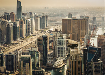Obraz premium Scenic view of modern city architecture. Aerial skyline of Dubai Marina, UAE, with skyscrapers. Travel background.