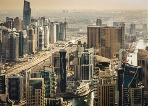 Scenic view of modern city architecture. Aerial skyline of Dubai Marina, UAE, with skyscrapers. Travel background.
